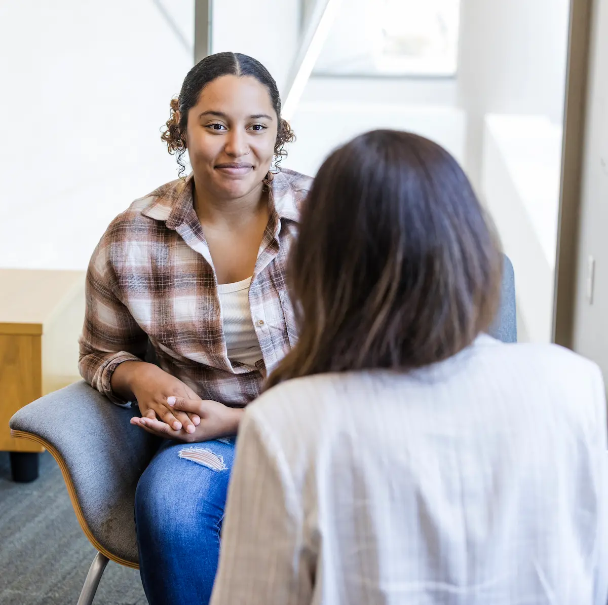 A calm, supportive one-on-one conversation during a care visit